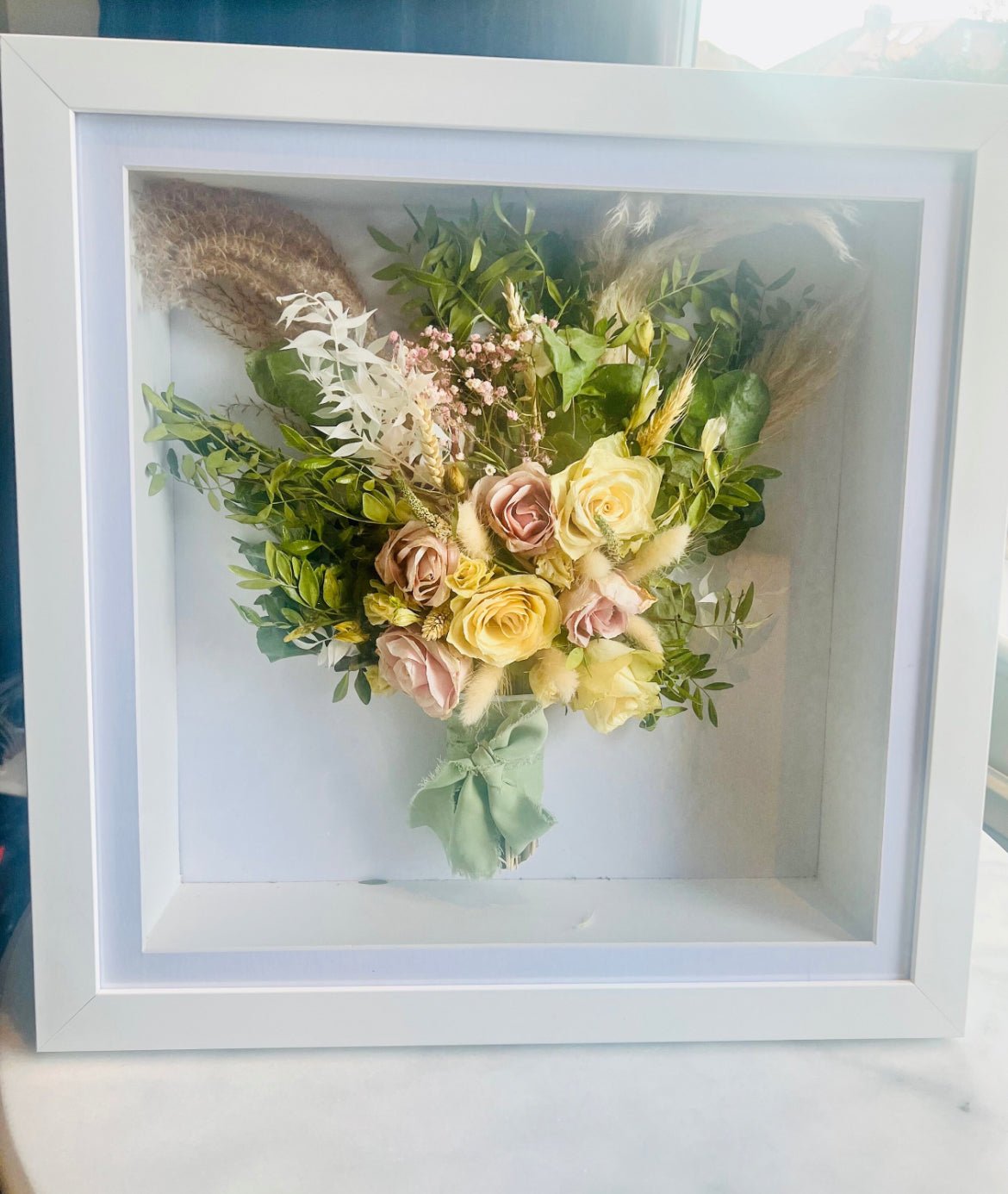 A real wedding bouquet preserved in clear resin by Artisan Palace